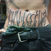 Invictus Lettering Tattoo