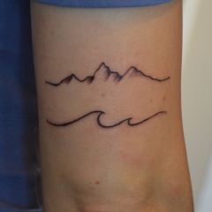 mountains waves tattoo