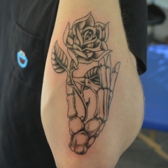 Skeleton Hand Tattoo Holding Rose